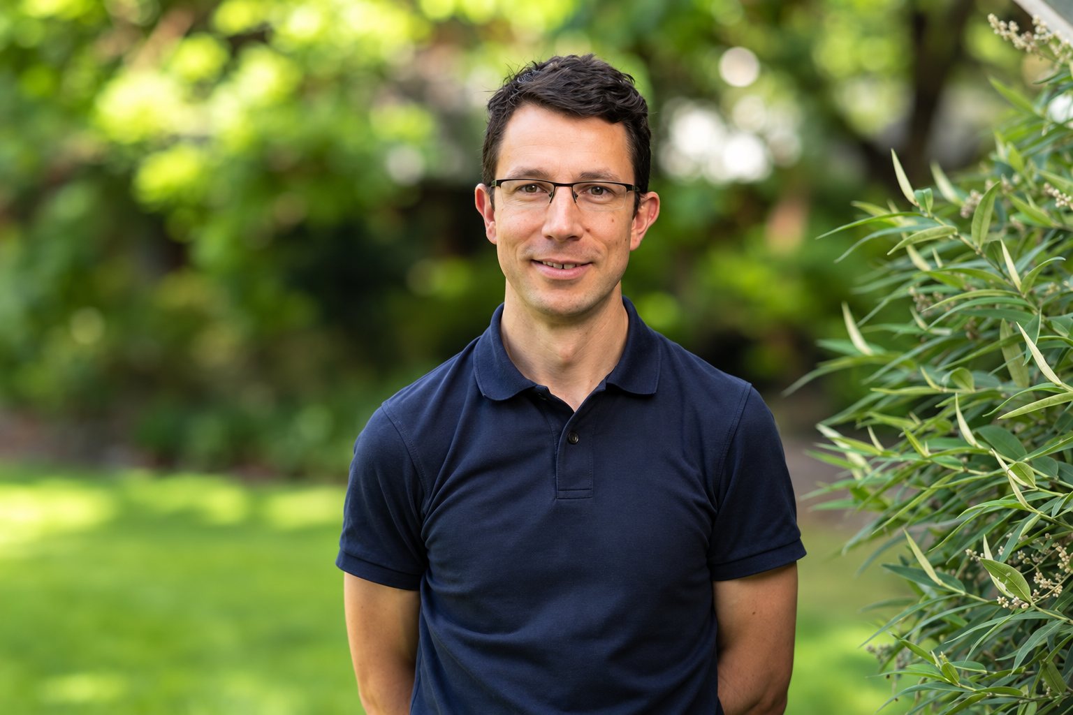 Adam Culvenor outdoors in a navy polo shirt